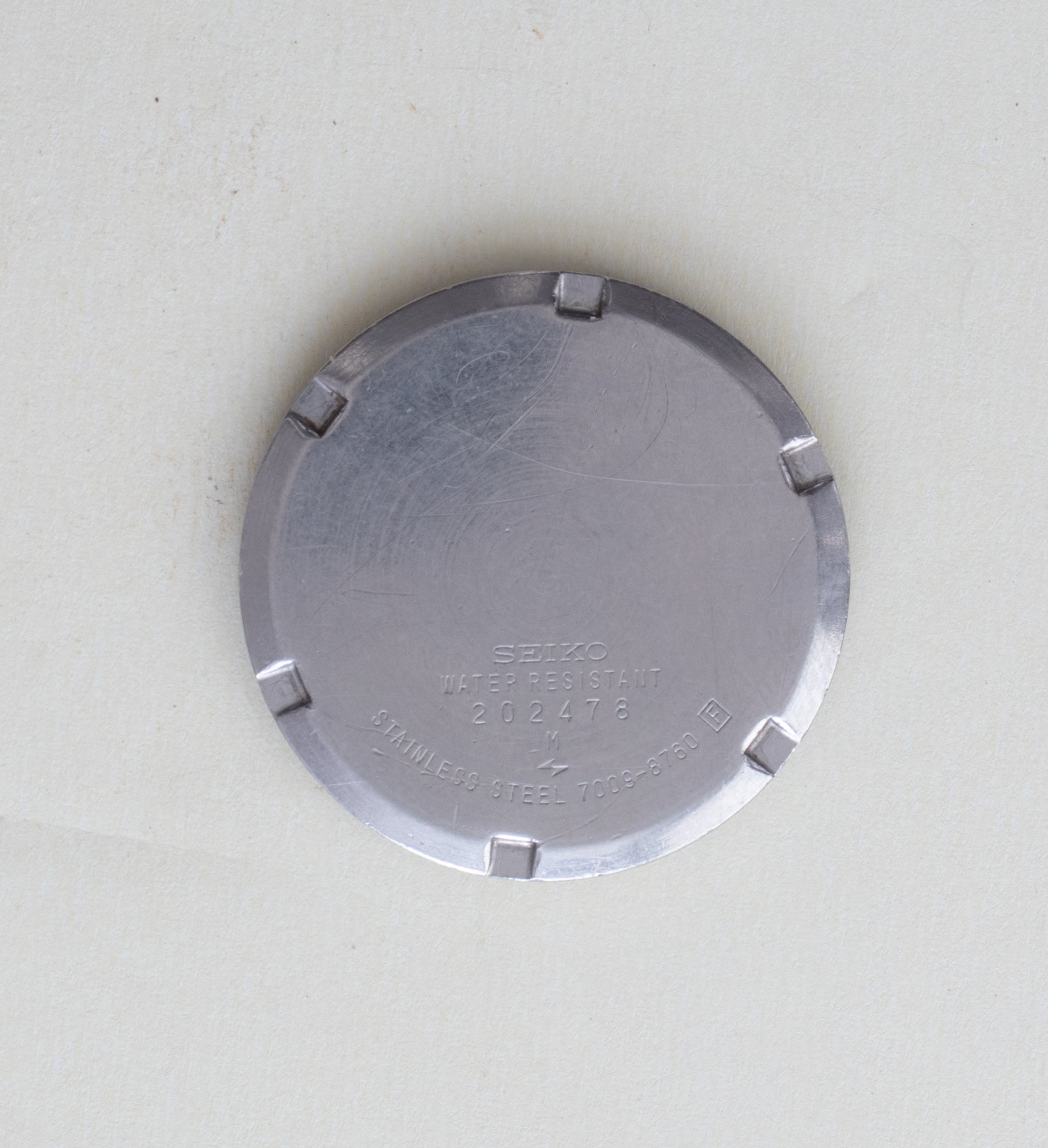 Caseback detail of Vintage Seiko 5 7009-8760 Automatic White Dial Octagonal Case Watch