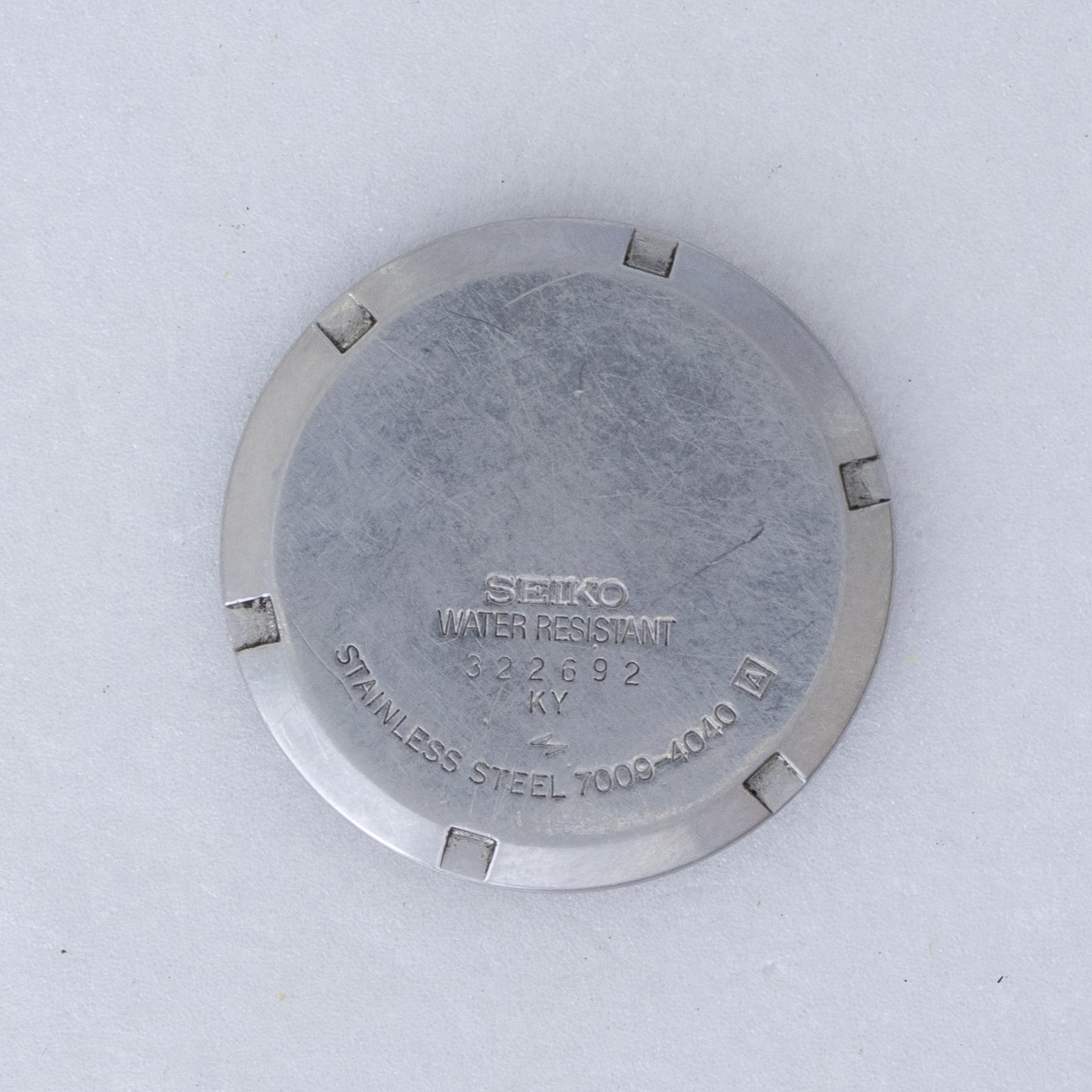 Caseback of Vintage Seiko 5 7009-4040 Automatic Silver 24-Hour Dial Watch showing reference details