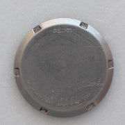 Caseback of Vintage Seiko 5 7009-6001 Automatic White 24-Hour Dial Watch showing reference details