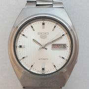 Dial close-up of Vintage Seiko 5 7009-8760 Automatic Silver Pinstripe Dial Watch