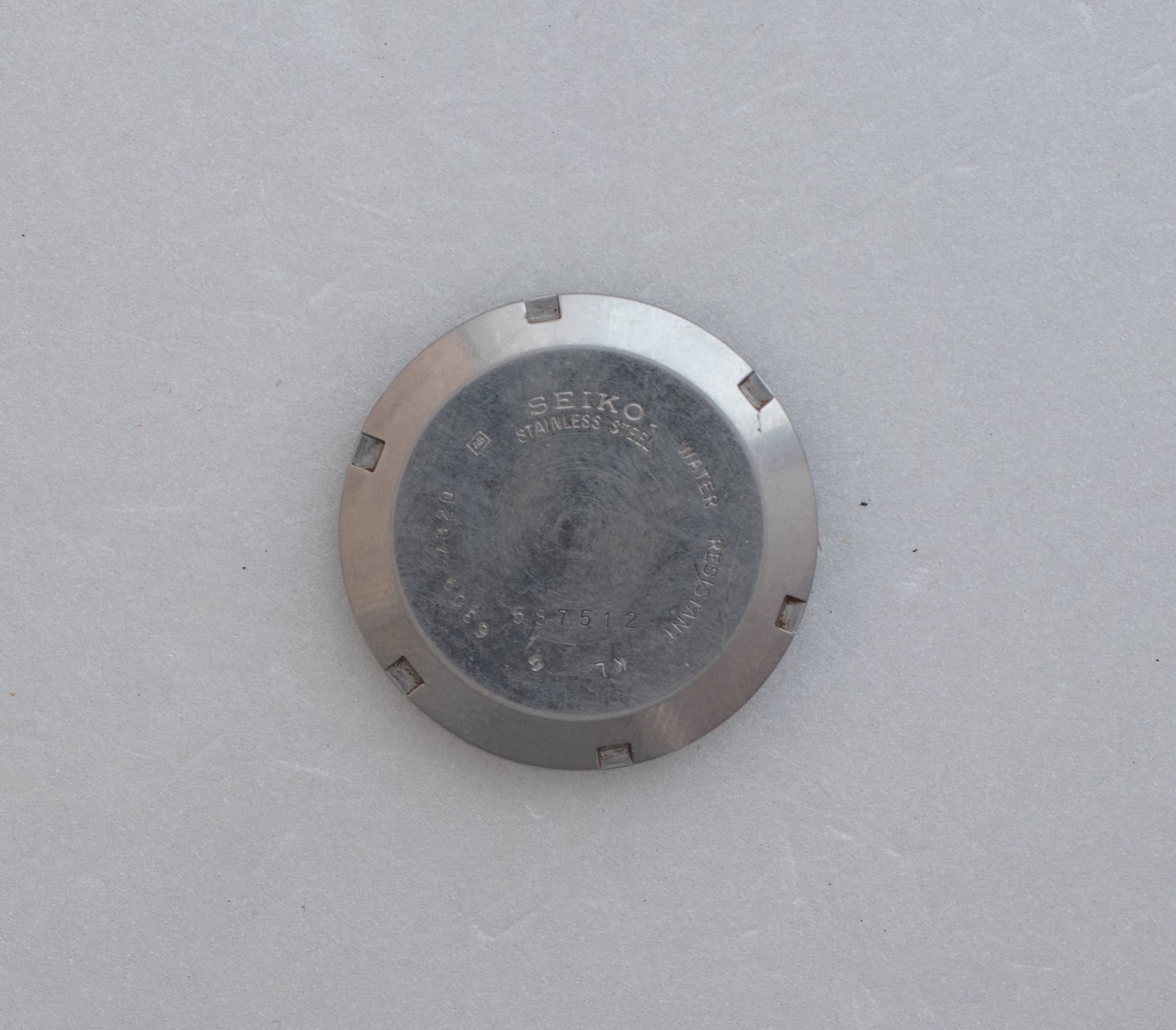 Caseback of Vintage Seiko 5 6309-7320 Automatic White Dial Watch showing reference details