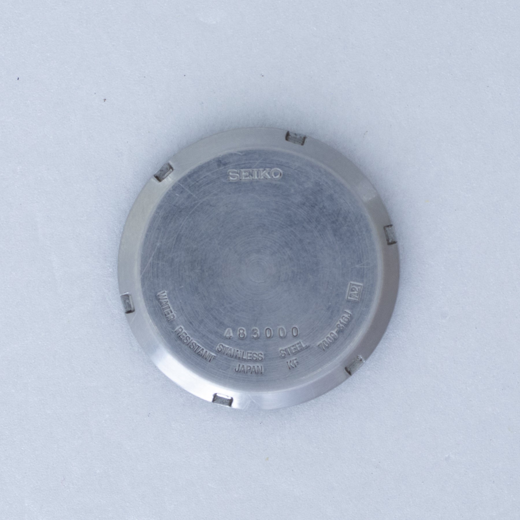 Caseback of Vintage Seiko 5 7009-816J Automatic White Dial Watch showing reference details