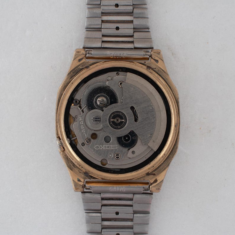 Vintage Seiko 5 7009-5862 Automatic 17J Gold Dial Day Date Wristwatch