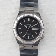 Vintage Seiko Sports 100 7546-703A Quartz Black Dial Day Date Wristwatch