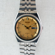 Vintage Seiko 5 7009-206K Automatic 17J Gold Dial Day Date Wristwatch