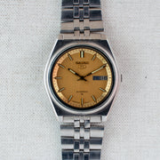 Vintage Seiko 5 7009-206K Automatic 17J Gold Dial Day Date Wristwatch