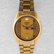 Vintage Seiko 5 7009-3100 Automatic 17J Gold Dial Day Date Wristwatch