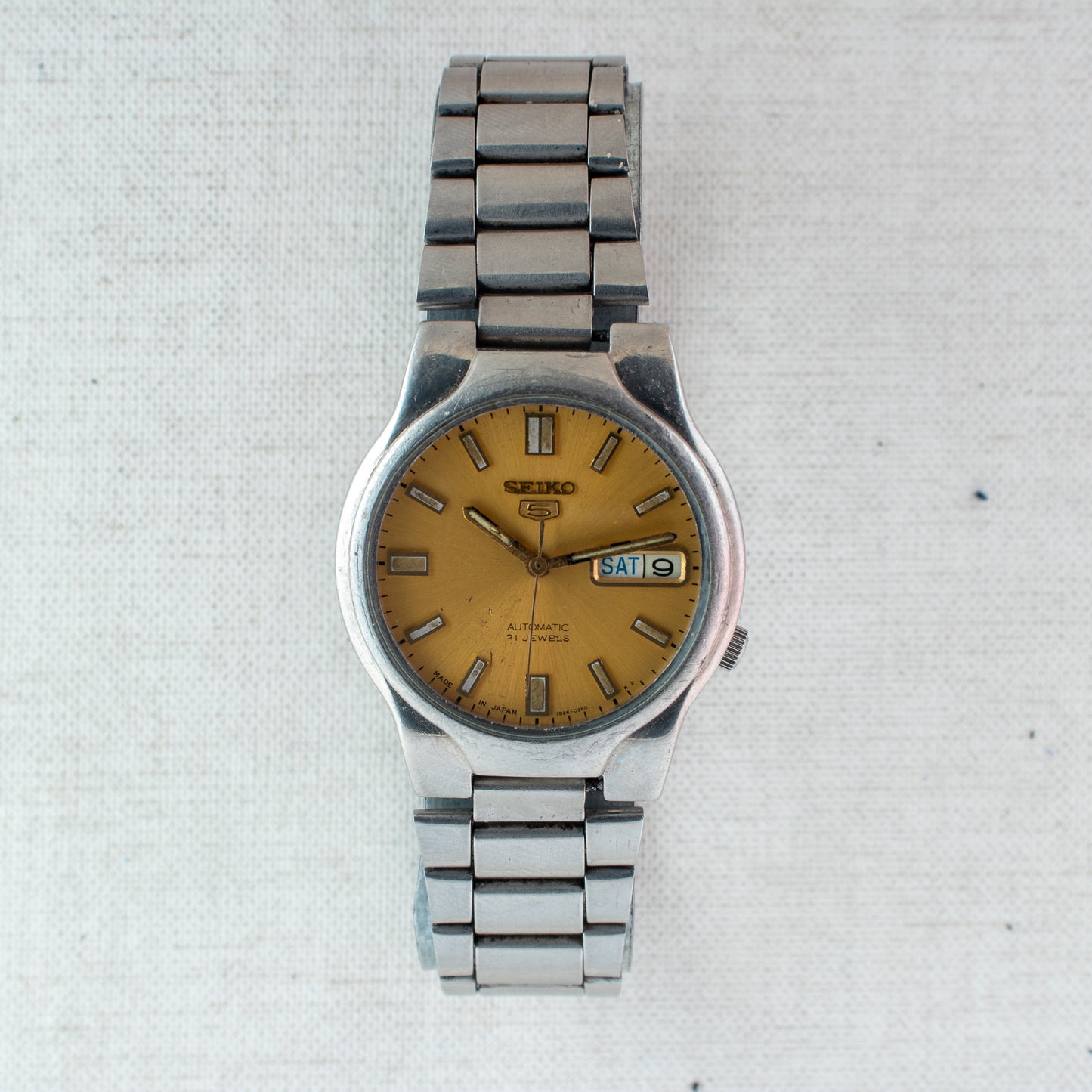 Seiko 5 Automatic Watch | Gold Dial 7S26-02P0 Exhibition Back Arabic English Day