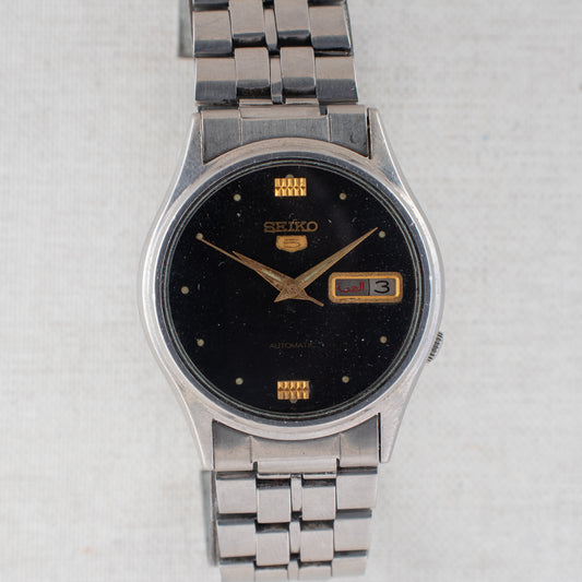 Vintage Seiko 5 Auto 7009-3100 Black Dial Gold Accents Arabic/English Day Watch